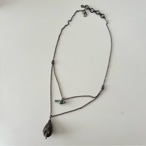 Fossil Necklace with Bird and Cage